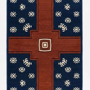 Southwestern geometric area rug featuring a large stepped rust cross and cream tribal star motifs on a deep navy blue background.